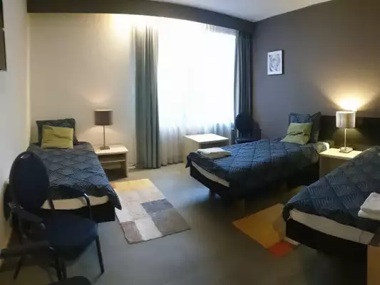 Een 3 persoonskamer bij City Hotel Winschoten