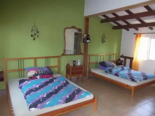 Een slaapkamer bij Bikerfarm Chiva